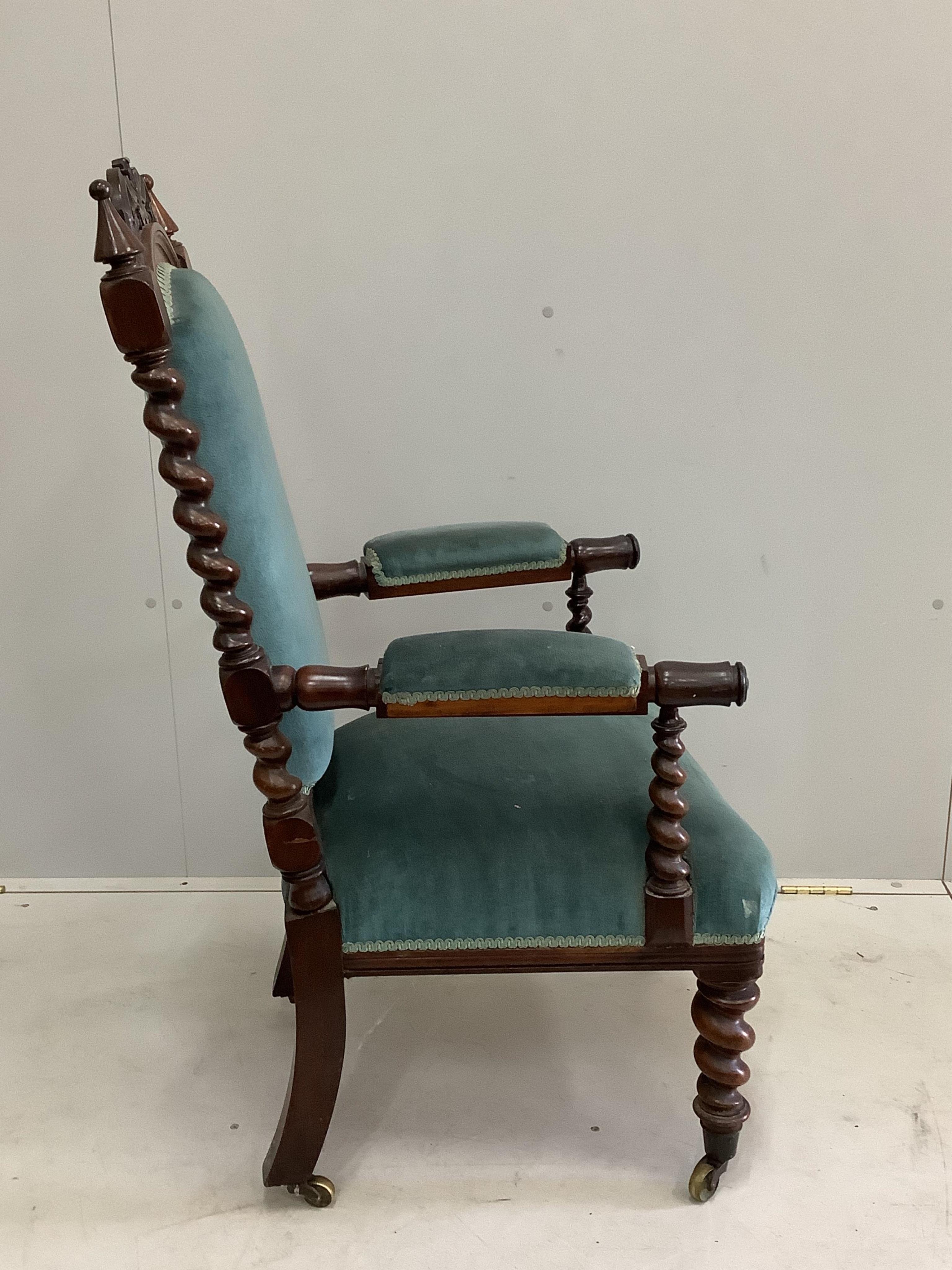 A Victorian Carolean style rosewood open armchair, width 58cm, depth 60cm, height 111cm